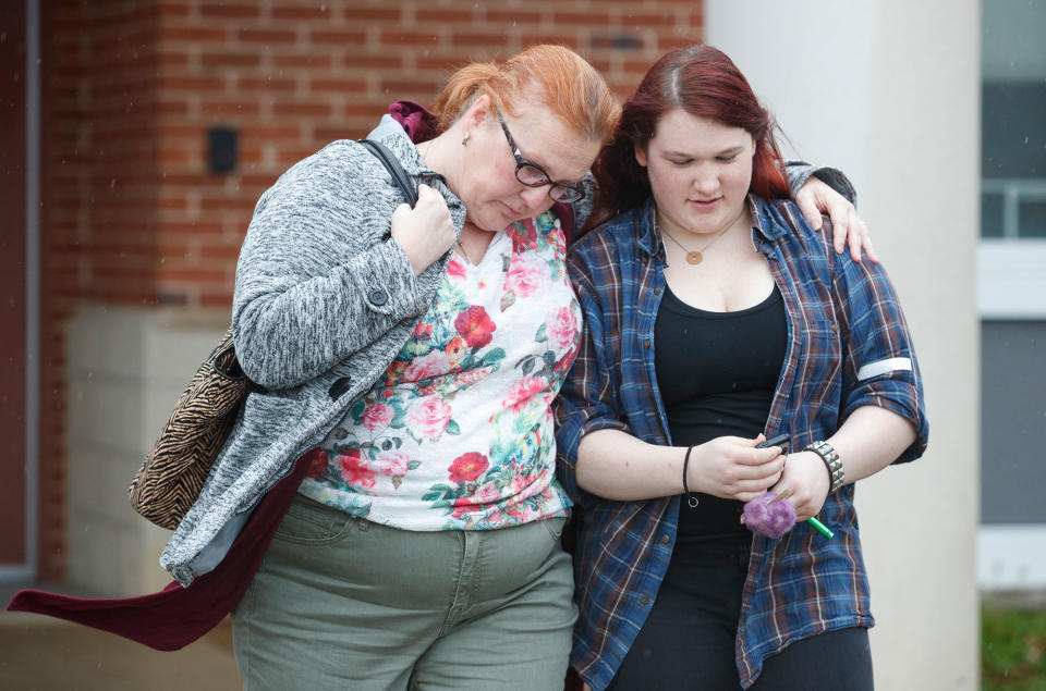 <p>A mother walks with her daughter, a student from Great Mills High School, as she picks her up from Leonardtown High School in Leonardtown, Md., Tuesday, March 20, 2018. (Photo: Carolyn Kaster/AP) </p>