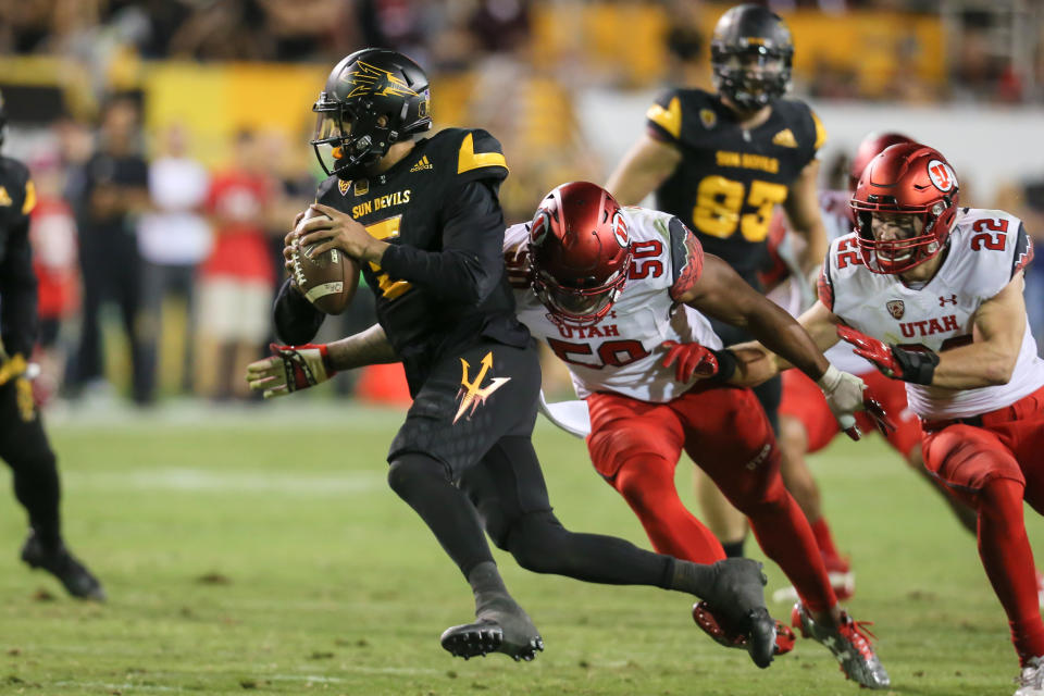 TEMPEPE, AZ - NOVEMBER 10: Arizona State Sun Devils quarterback Manny Wilkins (5) tries to nod to Utah Utes defensive end Pita Taumoepino (50) during the NCAA football game between the Utah Utes and Arizona State Sun Devils on November 10, 2016 at Sun Stadium Deville in Tempe, Arizona.  (Photo by Kevin Appel/Icon Sportswire via Getty Images)