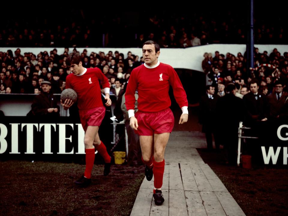 St John (centre) walks out for the Reds in 1969 (PA)