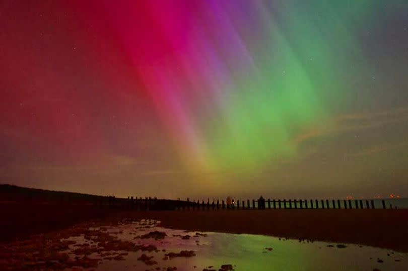 Beach, and northern lights above the sand