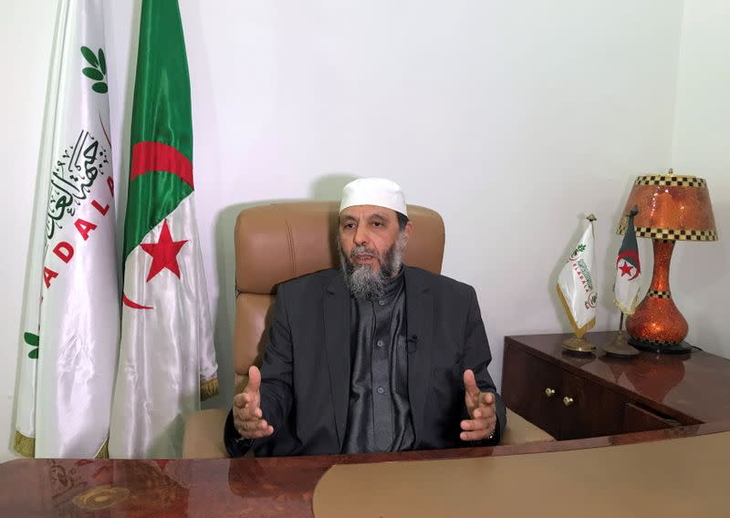 Djaballah gestures during an interview at his office in Algiers