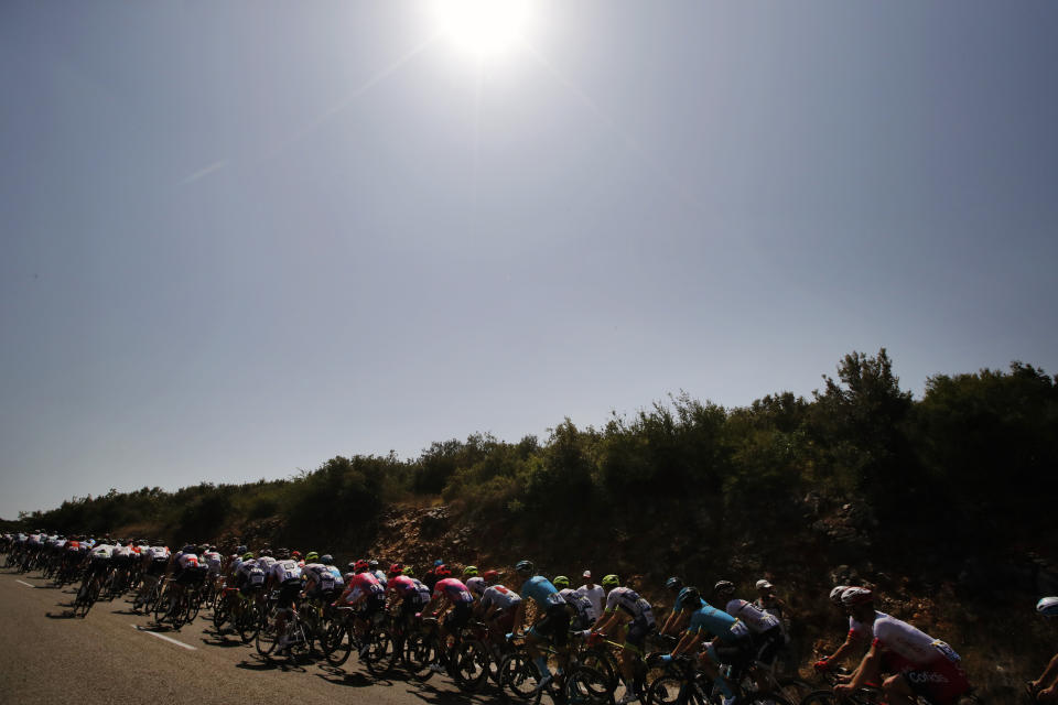 The pack rides during the sixteenth stage of the Tour de France cycling race over 117 kilometers (73 miles) with start and finish in Nimes, France, Tuesday, July 23, 2019. (AP Photo/ Christophe Ena)