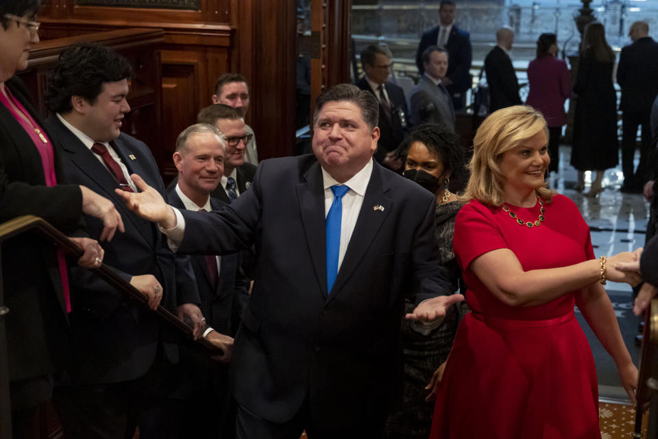 Gov. J.B. Pritzker arrives with first lady M.K. Pritzker to deliver his his combined budget and State of the State address to a joint session of the General Assembly on Wednesday, Feb. 15, 2023 at the Illinois State Capitol in Springfield, Ill. (Brian Cassella/Chicago Tribune via AP, Pool)