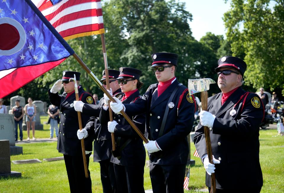 The Milford Fire Department honor guard takes part in a Memorial Day ceremony at Greenlawn Cemetery Monday, May 27, 2024.