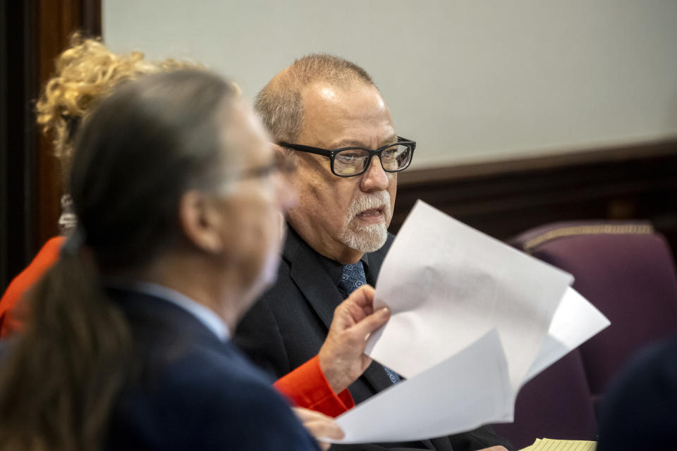 Greg McMichael, center, listens to jury selection for the trial of he and his son Travis McMichael and William "Roddie" Bryan, at the Glynn County Courthouse, Monday, Oct. 25, 2021, in Brunswick, Ga. The trio are charged with the slaying of 25-year-old Ahmaud Arbery in February 2020. (AP Photo/Stephen B. Morton, Pool)