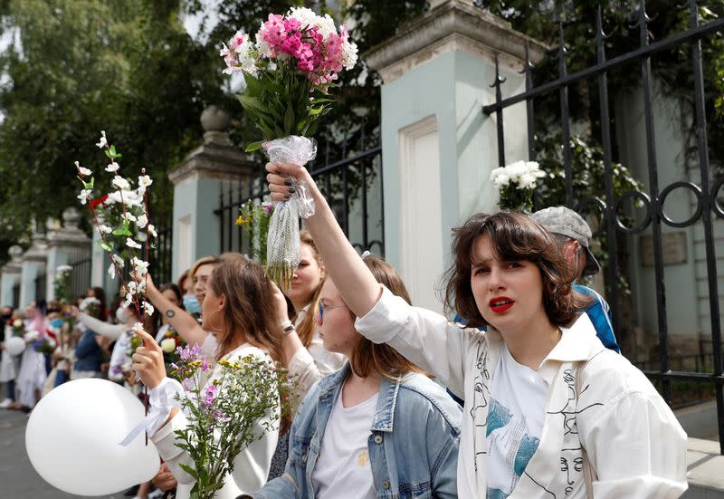 Women attend a rally in solidarity with Belarusian people in Moscow