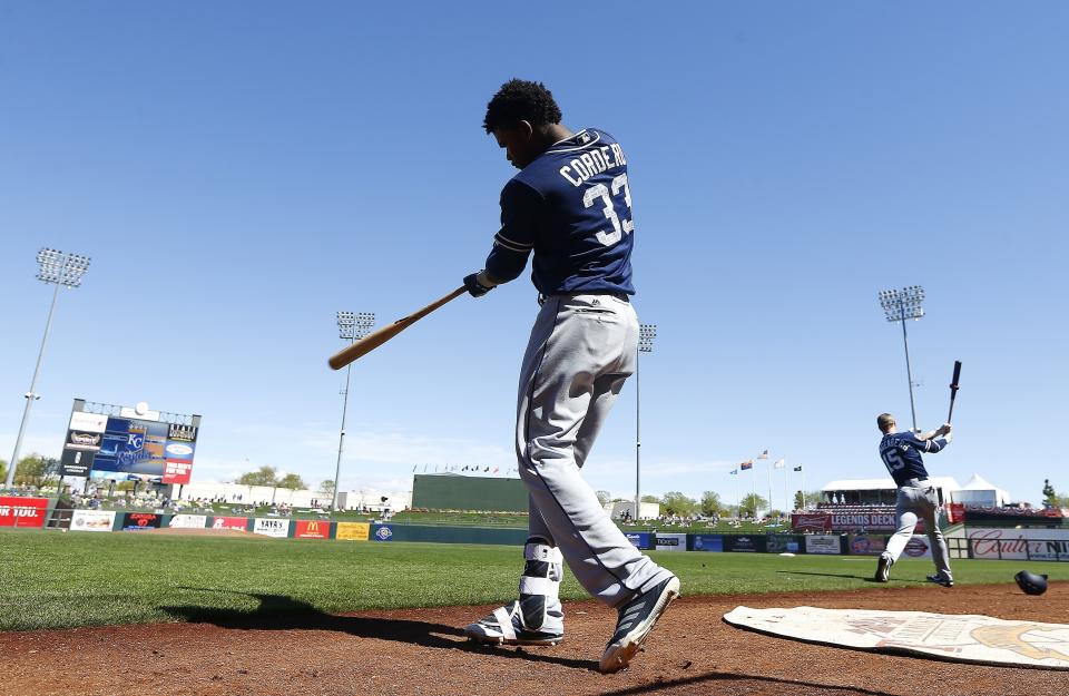 Franchy Cordero (33) and Cory Spangenberg (15) take practice swings prior to a spring training baseball game last month (AP Photo/Ross D. Franklin)