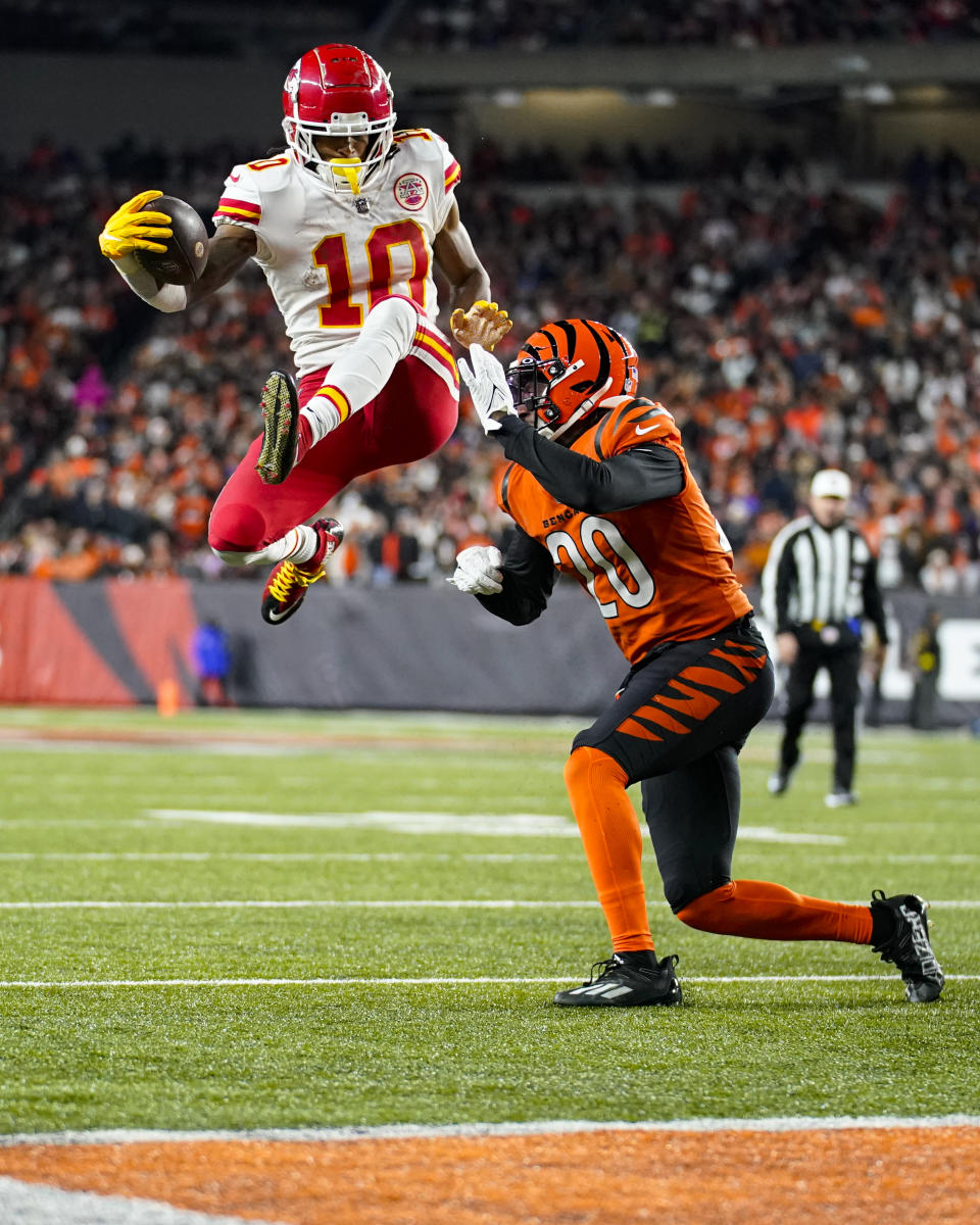 Kansas City Chiefs running back Isiah Pacheco (10) leaps over Cincinnati Bengals cornerback Eli Apple (20) in the second half of an NFL football game in Cincinnati, Fla., Sunday, Dec. 4, 2022. (AP Photo/Joshua Bickel)