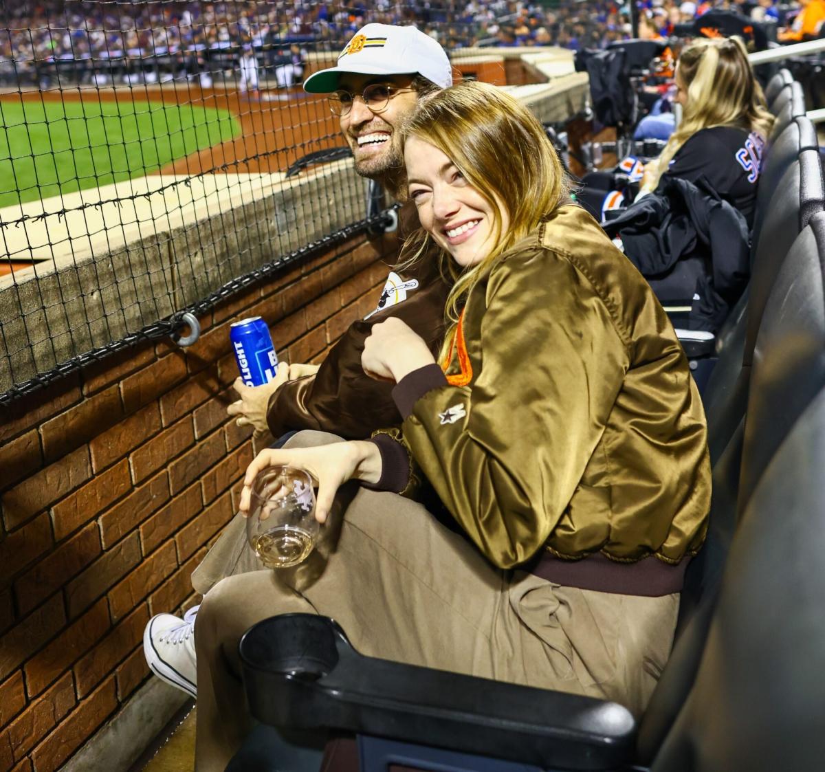 Emma Stone, husband Dave McCary pose for photos at Padres game