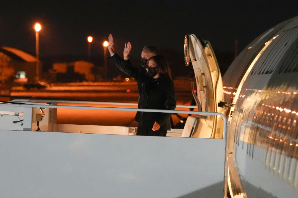 Vice President Kamala Harris and her husband Doug Emhoff wave as they board Air Force Two en route to Paris, at Andrews Air Force Base, Md., Monday, Nov. 8, 2021. (Sarahbeth Maney/The New York Times via AP, Pool)