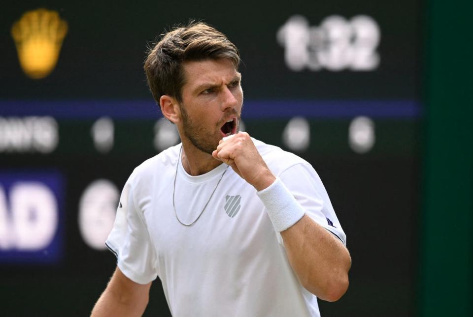 Cameron Norrie reacts after breaking serve during his fourth round match against Tommy Paul (REUTERS)