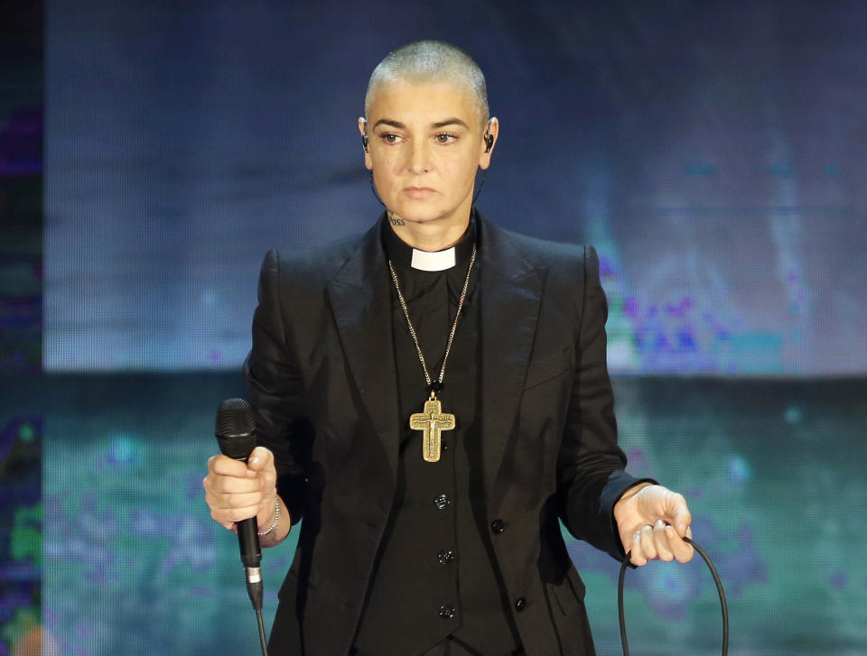 FILE - In this Oct. 5, 2014 file photo, Irish singer Sinead O'Connor performs during the Italian State RAI TV program "Che Tempo che Fa", in Milan, Italy. O'Connor, who died July 26, 2023, is among the 2024 nominees for induction into the Rock & Roll Hall of Fame. (AP Photo/Antonio Calanni, File)