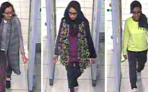 Kadiza Sultana, left, Shamima Begum, center, and Amira Abase going through security at Gatwick airport  - Credit: Metropolitan Police