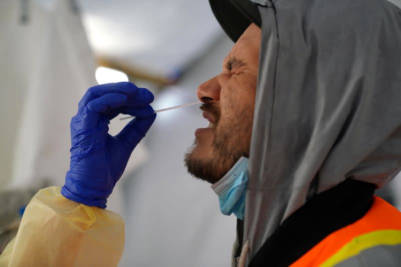 FILE PHOTO: Provincial health workers perform coronavirus disease tests in Gull Bay