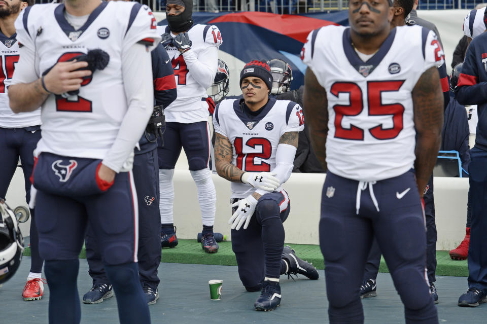 Houston Texans wide receiver Kenny Stills kneels during the national anthem before their game against the Tennessee Titans in Nashville in December. (AP/Mark Zaleski, File)