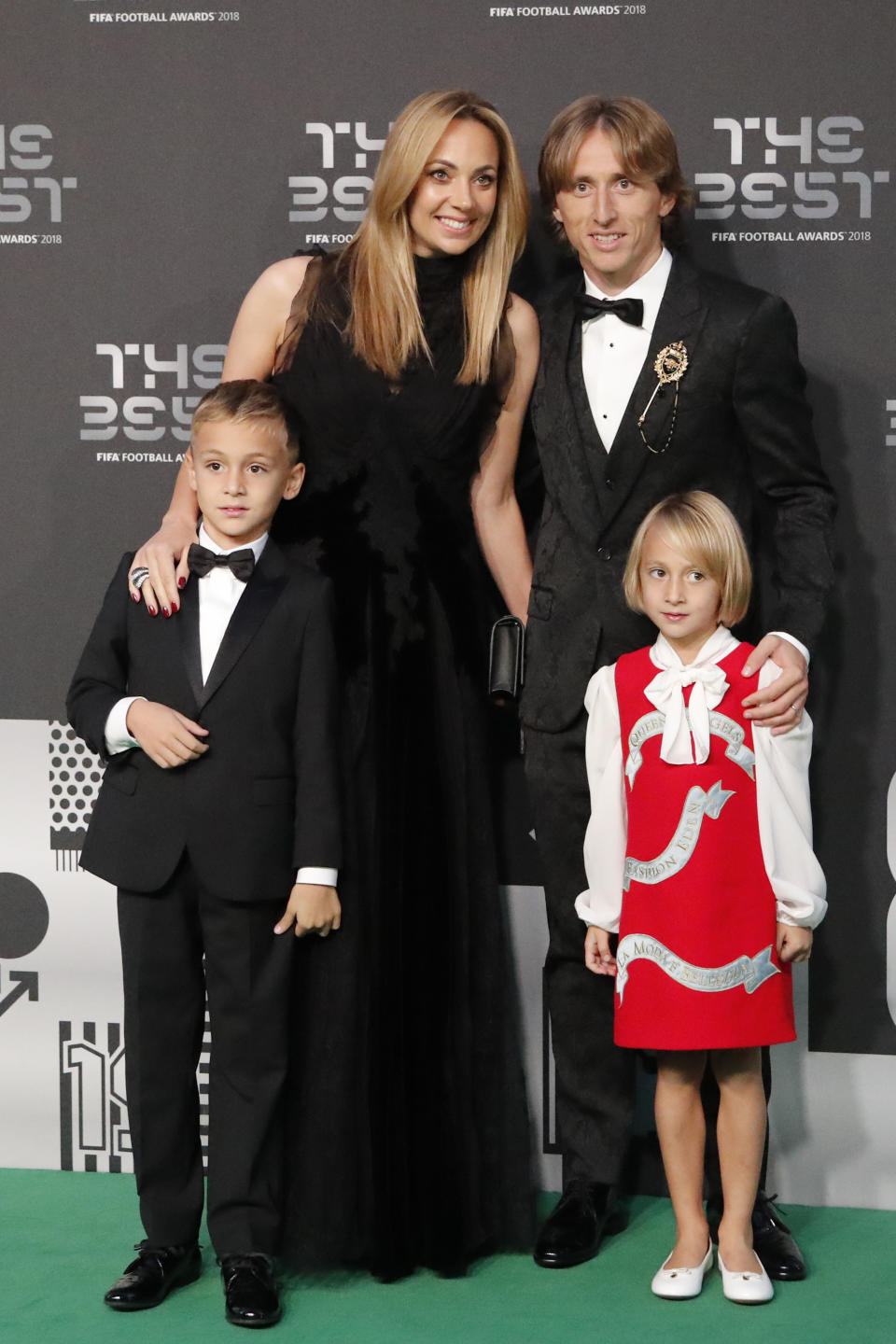 Croatia's soccer star Luka Modric, nominee for the Best FIFA Men's Player award, and his wife Vanja Bosnic, his son Ivano and his daughter Ema, arrive for the ceremony of the Best FIFA Football Awards in the Royal Festival Hall in London, Britain, Monday, Sept. 24, 2018. (AP Photo/Frank Augstein)