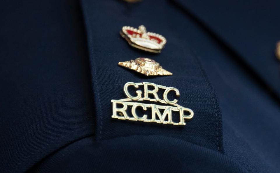 The RCMP logo is seen on the shoulder of a superintendent during a news conference, Saturday, June 24, 2023, in St. John’s, Newfoundland. The B.C. Coroners' Service has called an inquest into a 2019 police shooting that left two people dead, including the hostage officers were trying to save. 