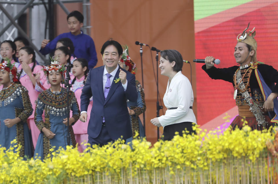 New Taiwan's President Lai Ching-te, center left, and Vice President Hsiao Bi-khim, center right, cheer with performers during Lai''s inauguration ceremony in Taipei, Taiwan, Monday, May 20, 2024 (AP Photo/Chiang Ying-ying)