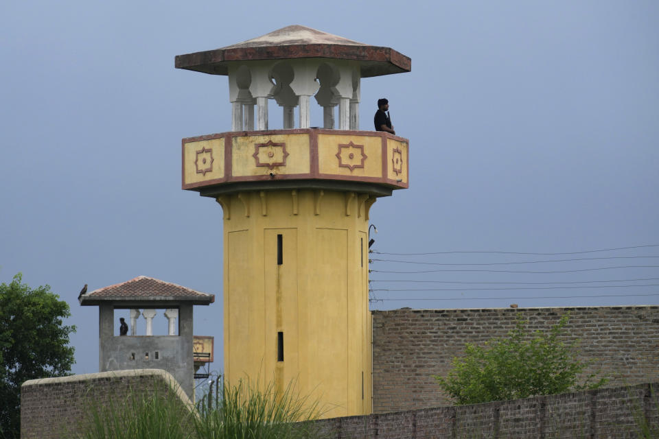 Police officers stand guard on the watch towers of district prison Attock, where Pakistan's former Prime Minister Imran Khan in-prison after his conviction, in Attock, Pakistan, Sunday, Aug. 6, 2023. Khan was arrested Saturday after a court handed him a three-year jail sentence for corruption, a development that could end his future in politics. (AP Photo/Anjum Naveed)