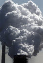 FILE - In this Monday, May 27, 2013 file photo, steam of a furnace pollutes the sky in Duisburg, Germany. The European Union says it will miss its targets for reducing planet-warming greenhouse gases by 2030 unless member states make a greater effort than they have so far. (AP Photo/Frank Augstein)