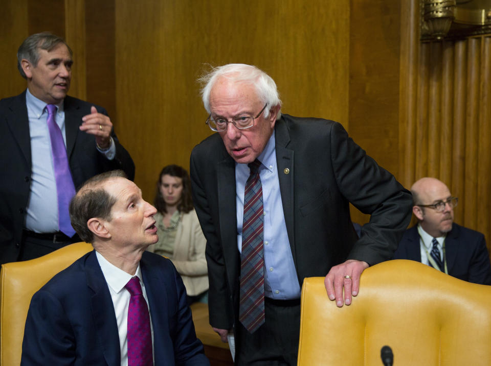 WASHINGTON, DC - NOVEMBER 28:  (L-R) Sen. Ron Wyden (D-OR) and Sen. Bernie Sanders (I-VT) speak before the full committee markup of the tax reform legislation on Capital Hill November 28, 2017 in Washington, DC. Republicans in the Senate hope to pass their legislation this week and work with the House of Representatives to get a bill to President Donald Trump before Christmas.   (Photo by Tasos Katopodis/Getty Images)
