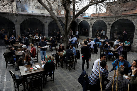 People enjoy a cafe in Sur, an historical district of southeastern province of Diyarbakir, Turkey, March 10, 2017. Picture taken March 10, 2017. REUTERS/Umit Bektas