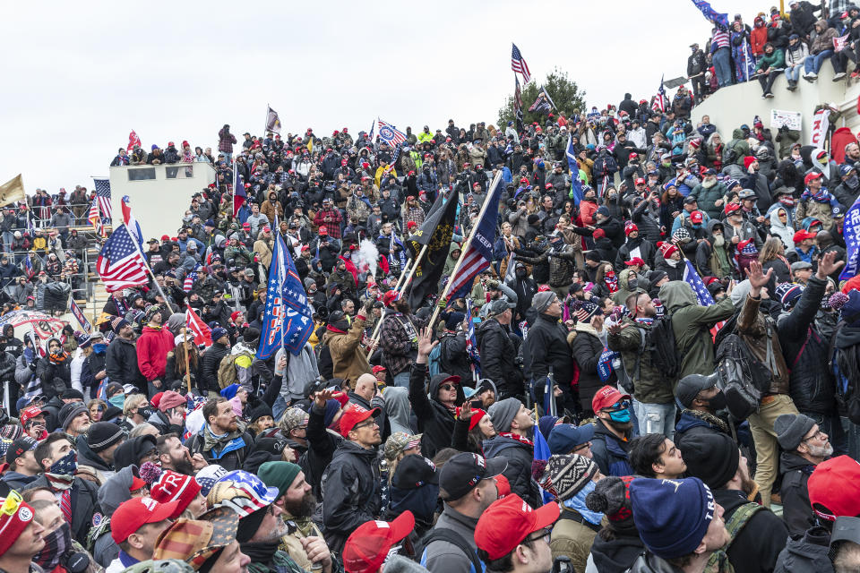 Pro-Trump supporters gather at the Capitol building. Police used batons and tear gas grenades to eventually disperse the crowd. Rioters used metal bars and tear gas against the police. (Lev Radin/Pacific Press/LightRocket via Getty Images)