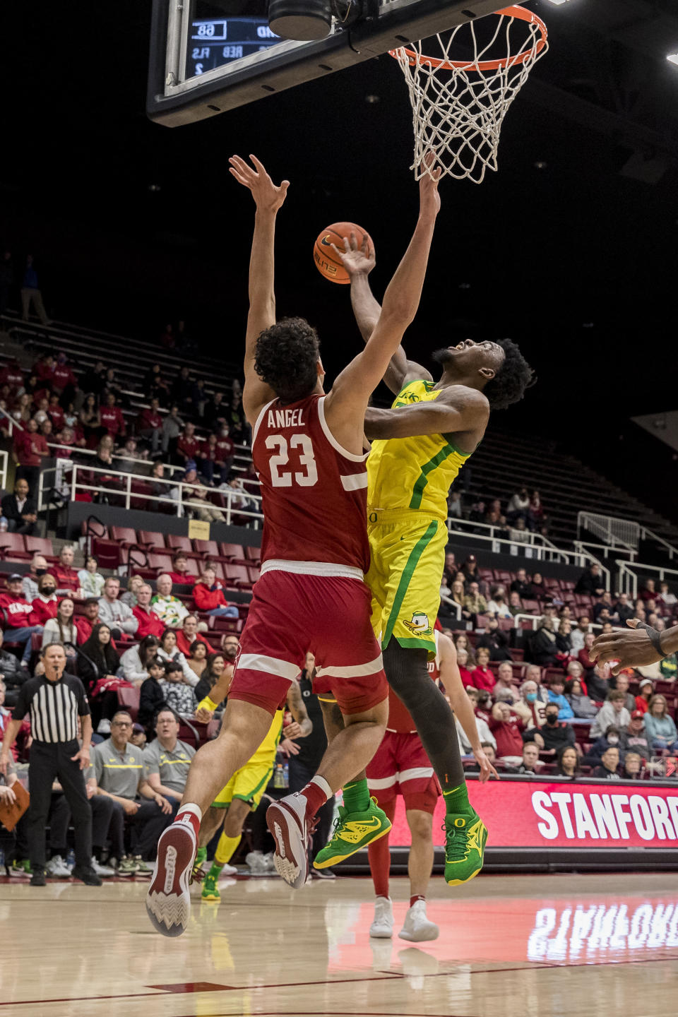 Stanford forward Brandon Angel (23) fouls Oregon guard Jermaine Couisnard during the second half of an NCAA college basketball game in Stanford, Calif., Saturday, Jan. 21, 2023. Stanford won 71-64. (AP Photo/John Hefti)