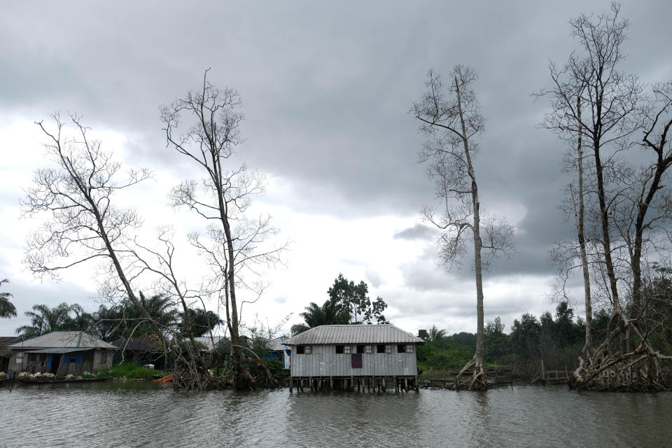 Small houses are seen by the bank of a river in Delta State, Nigeria. (Reuters/Paul Carsten)