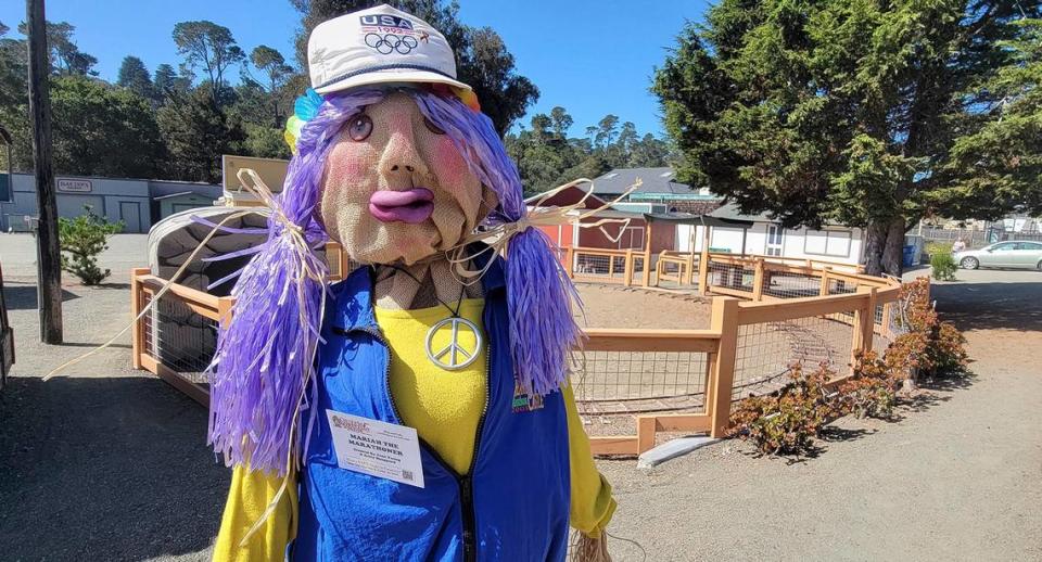 Scarecrow sculptures are on display in Cambria and San Simeon, California, in October 2023. Mariah the Marathoner stands in front of the Pinderado Grounds on Main Street.