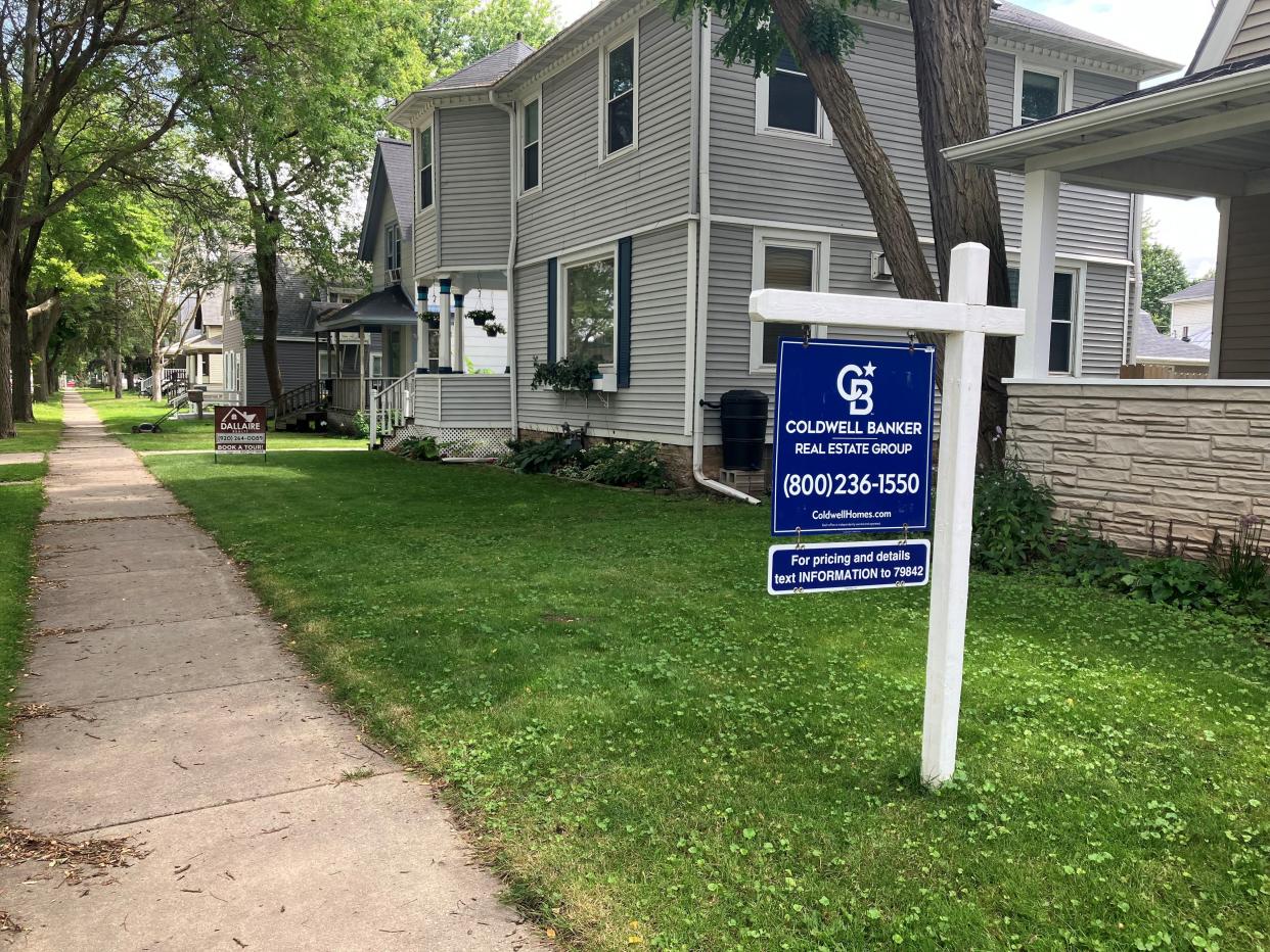 Two homes for sale next to each other on Dousman Street in Green Bay in July 2024.