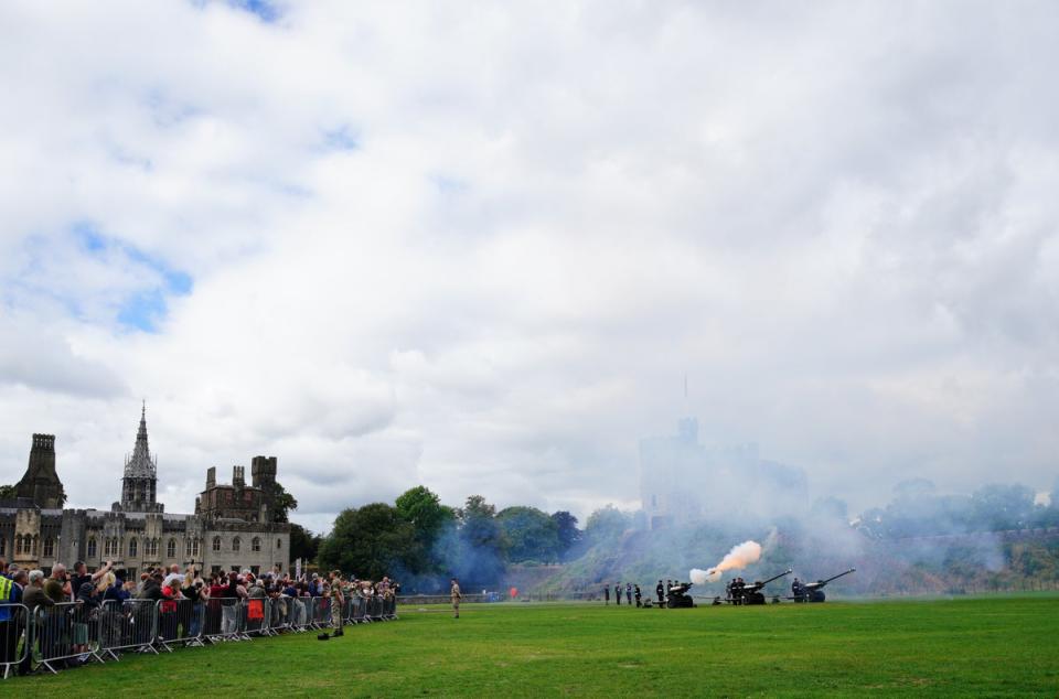 Crowds watched at the salute was fired in Cardiff (Ben Birchall/PA) (PA Wire)