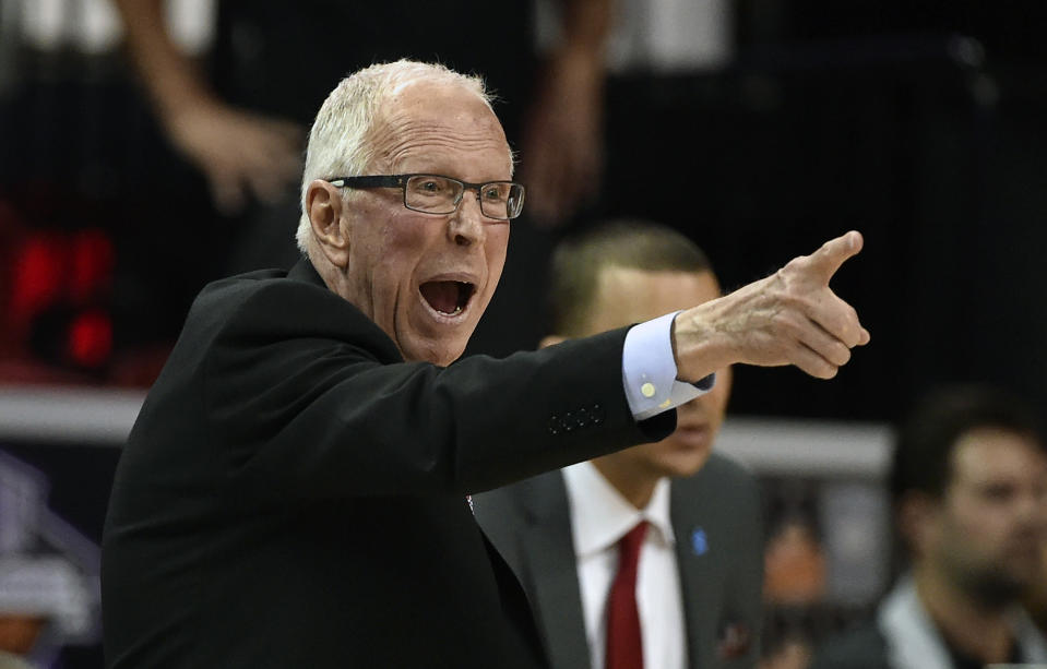 FILE - In this March 10, 2016, file photo, San Diego State coach Steve Fisher calls to his team during the second half of an NCAA college basketball game against Utah State at the Mountain West Conference men's tournament in Las Vegas. Two people with knowledge of the situation said Monday, April 10, 2017, that Fisher is retiring after spending 18 seasons as San Diego State's basketball coach. (AP Photo/David Becker, File)