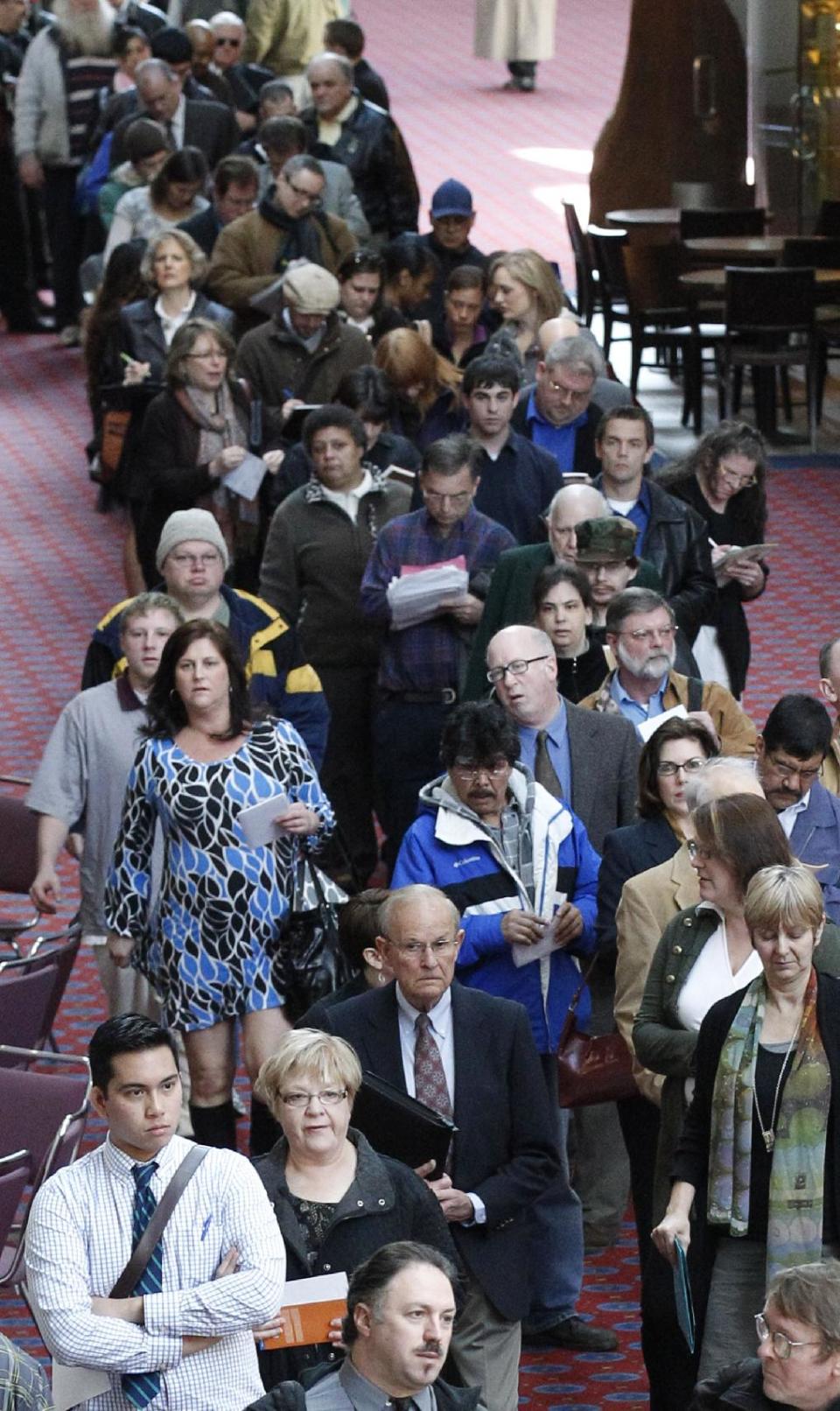 FILE - In this March 7, 2012, file photo, job seekers stand in line during a Career Expo job fair, in Portland, Ore. The Labor Department said Friday, May 4, 2012, that the economy added just 115,000 jobs in April. U.S. employers pulled back on hiring for the second straight month, evidence of an economy still growing only sluggishly. The unemployment rate fell to 8.1 percent, but only because more people gave up looking for work. (AP Photo/Rick Bowmer, File)