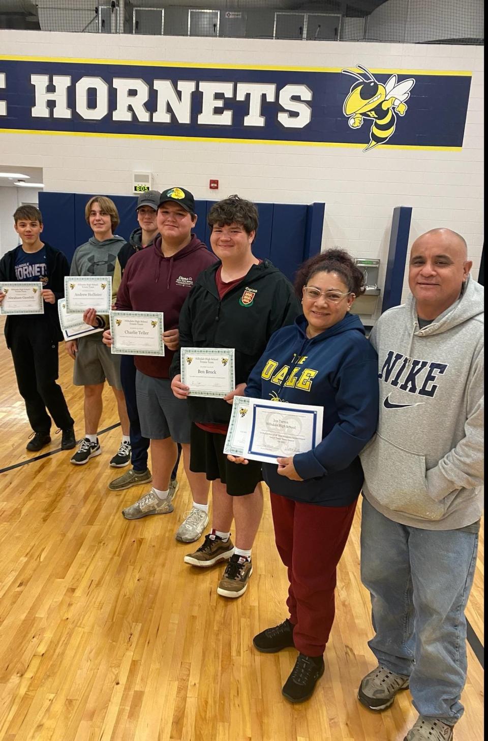 (Pictured from front to back): Jon Torres' parents Salvador and Herminia Torres representing their son, Ben Brock, Charlie Teller, Andrew Hollister, Sam Wiles, and Brohm Gambill. (Not Pictured): Jon Torres, Erik Hecklinger, Soren Gambill, Alex Portteus, and Broderick Miller.