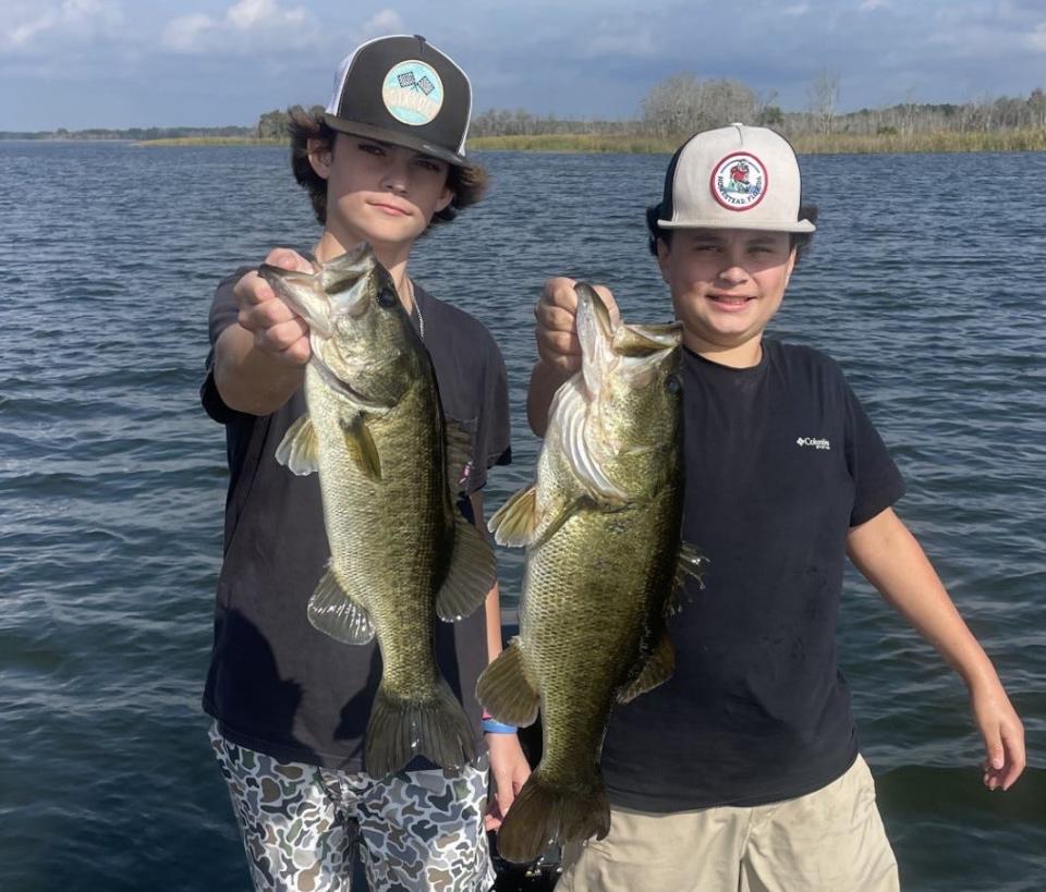 These two 13-year-old anglers, Carson Stemmer (left) and Raymond Cardona with a pair of bass caught last weekend. Raymond's bass checked in at 5.2 pounds.