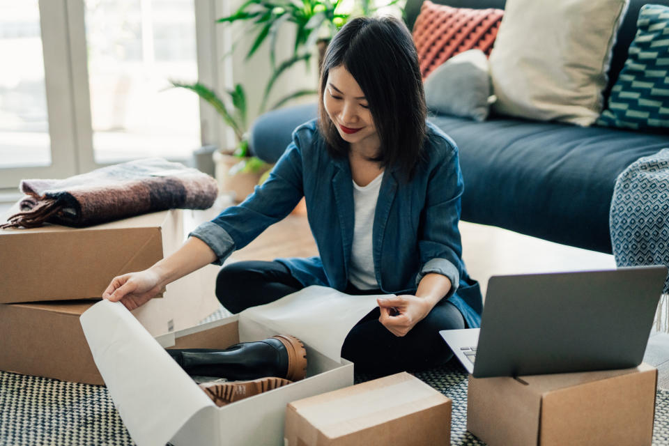 Young woman using laptop to online shop at ShopBack