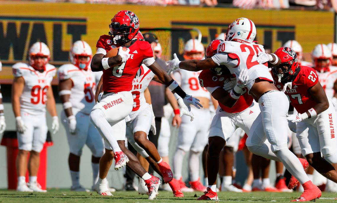 N.C. State’s Julian Gray (8) breaks free for a touchdown on a 82-yard kickoff return during the second half of the Wolfpack’s 45-7 victory over VMI at Carter-Finley Stadium in Raleigh, N.C., Saturday, Sept. 16, 2023.