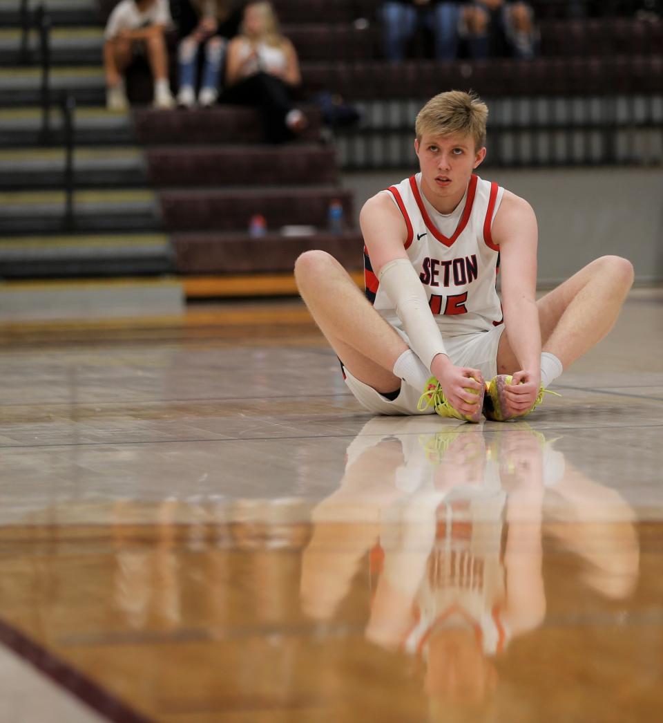 Seton junior Mason Harvey stretches before a game against Northeastern Nov. 23, 2022.