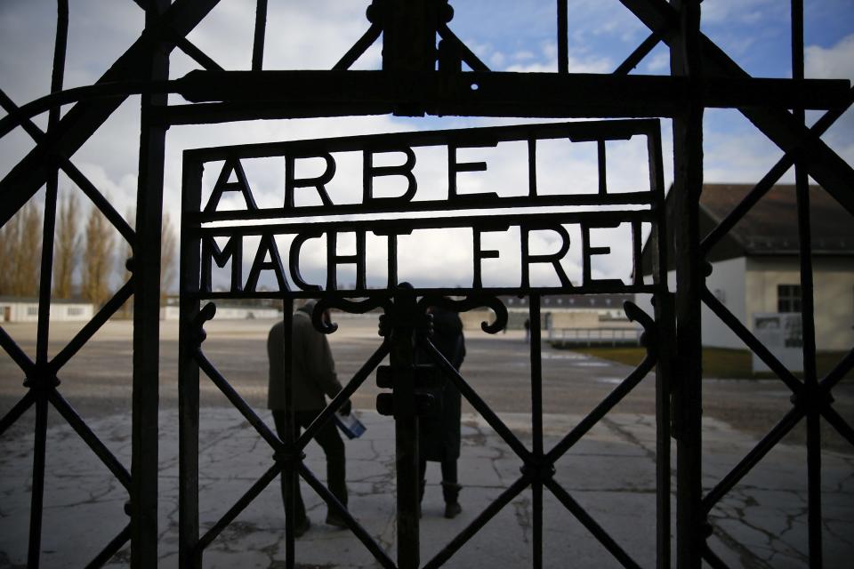 The main gate of the former Dachau concentration camp with the sign "Arbeit macht frei" (work sets you free) is seen in Dachau, near Munich, in this January 25, 2014 file picture. German police say part of the gate bearing the sign has been stolen, according to media reports on November 2, 2014. REUTERS/Michael Dalder/Files (GERMANY - Tags: SOCIETY)