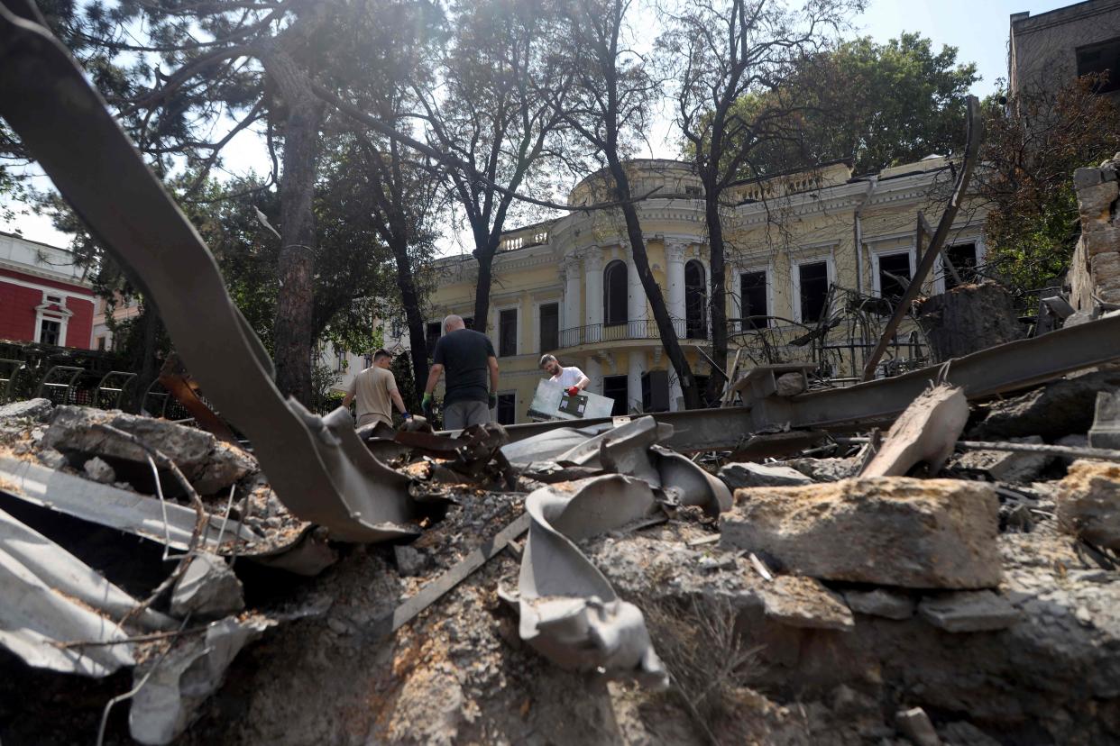 File photo: Workers clear the rubble in the center of Odesa on July 24, 2023, the day after a military strike (AFP via Getty Images)