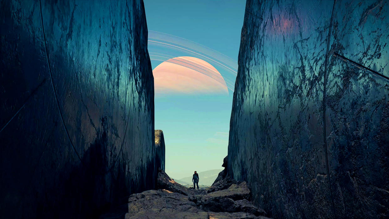  Starfield screenshot showing a distant man on an alien planet, standing between two massive obsidian-like walls with a ringed world visible in the distance. 