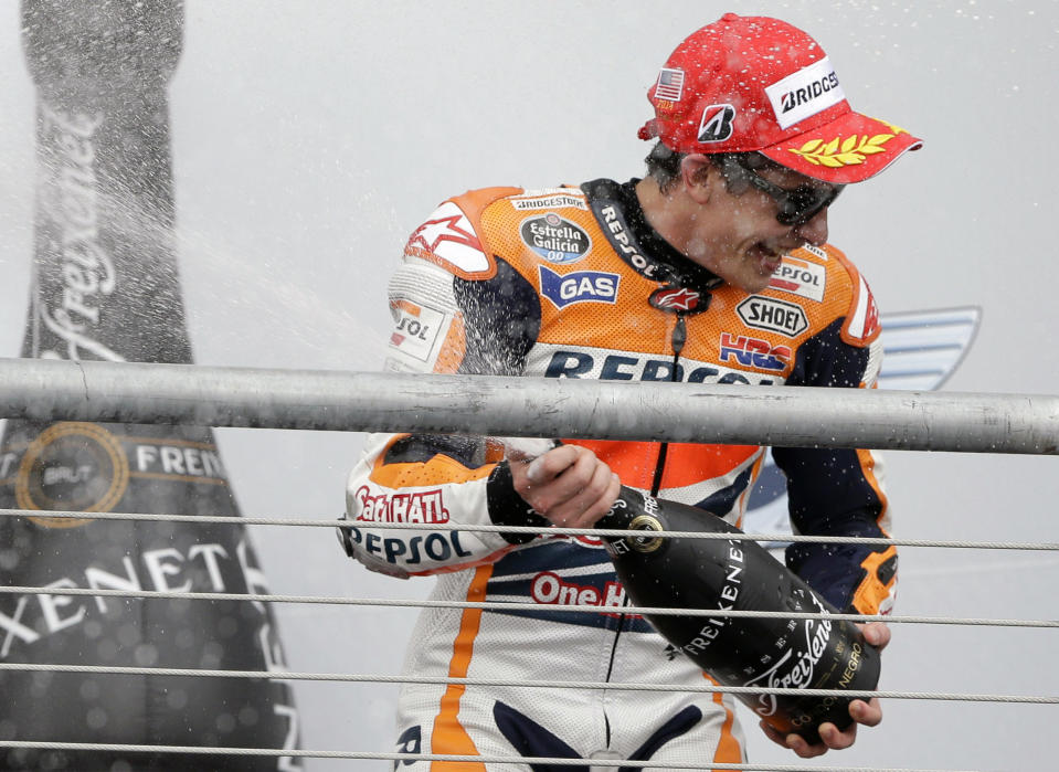 Marc Marquez, of Spain, celebrates his win in the MotoGP Grand Prix of the Americas motorcycle race at the Circuit of the Americas, Sunday, April 13, 2014, in Austin, Texas. (AP Photo/Eric Gay)