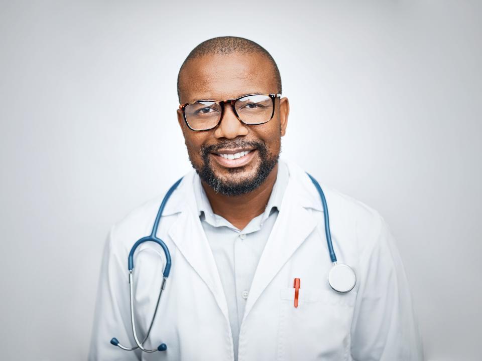 A stock photo of a black male doctor. 