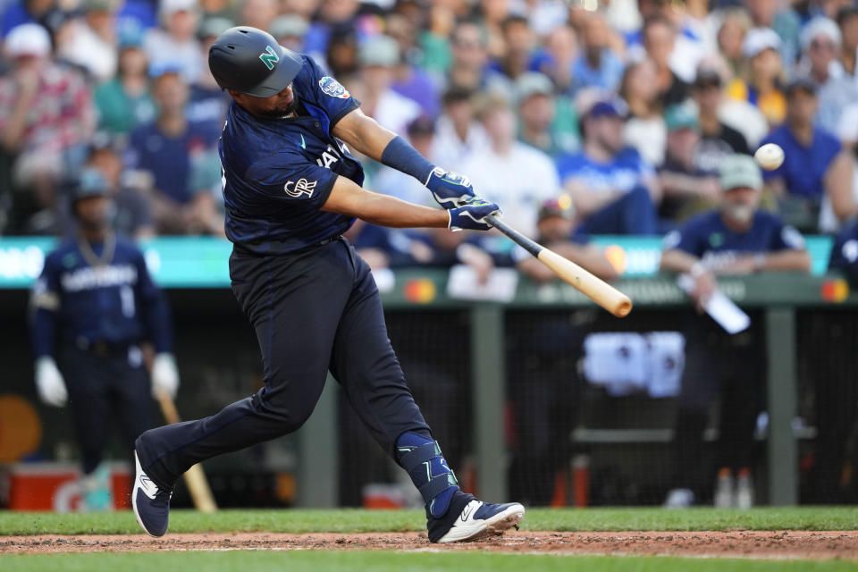 Elias Díaz of the Colorado Rockies was a surprise hero for the National League on Tuesday, hitting a two-run home run in the eighth inning of the 2023 MLB All-Star Game in Seattle. (AP Photo/Lindsey Wasson)