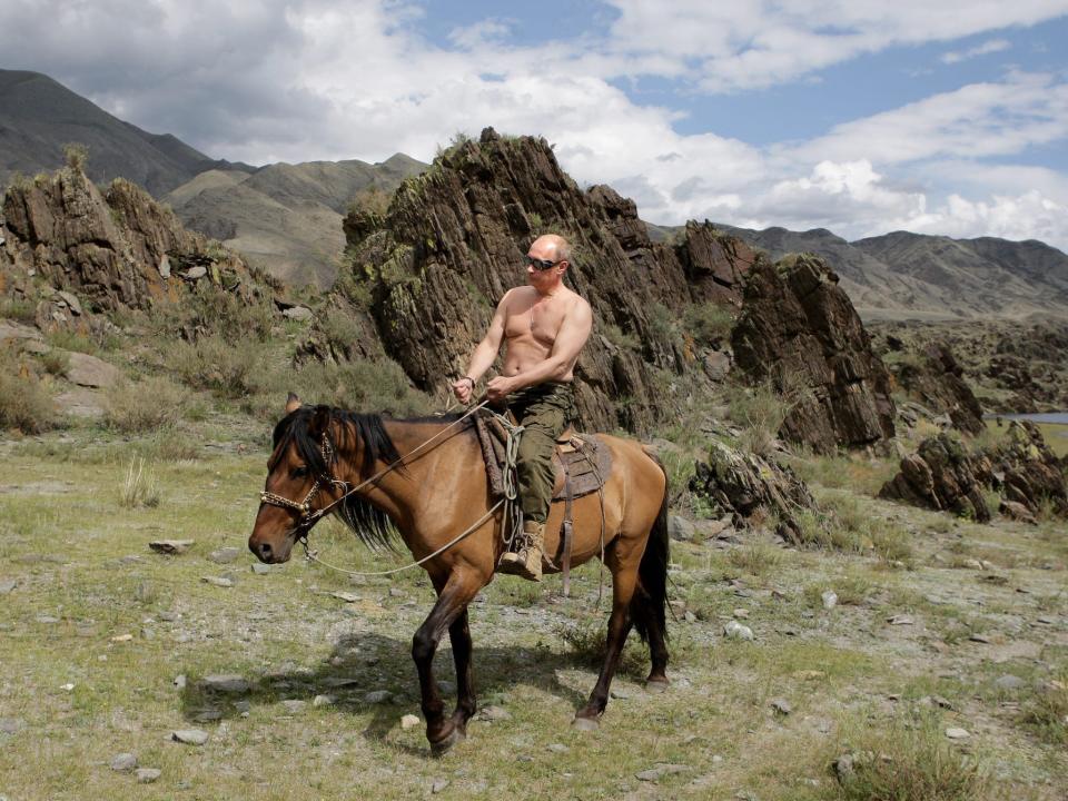 Vladimir Putin shirtless on a horse.