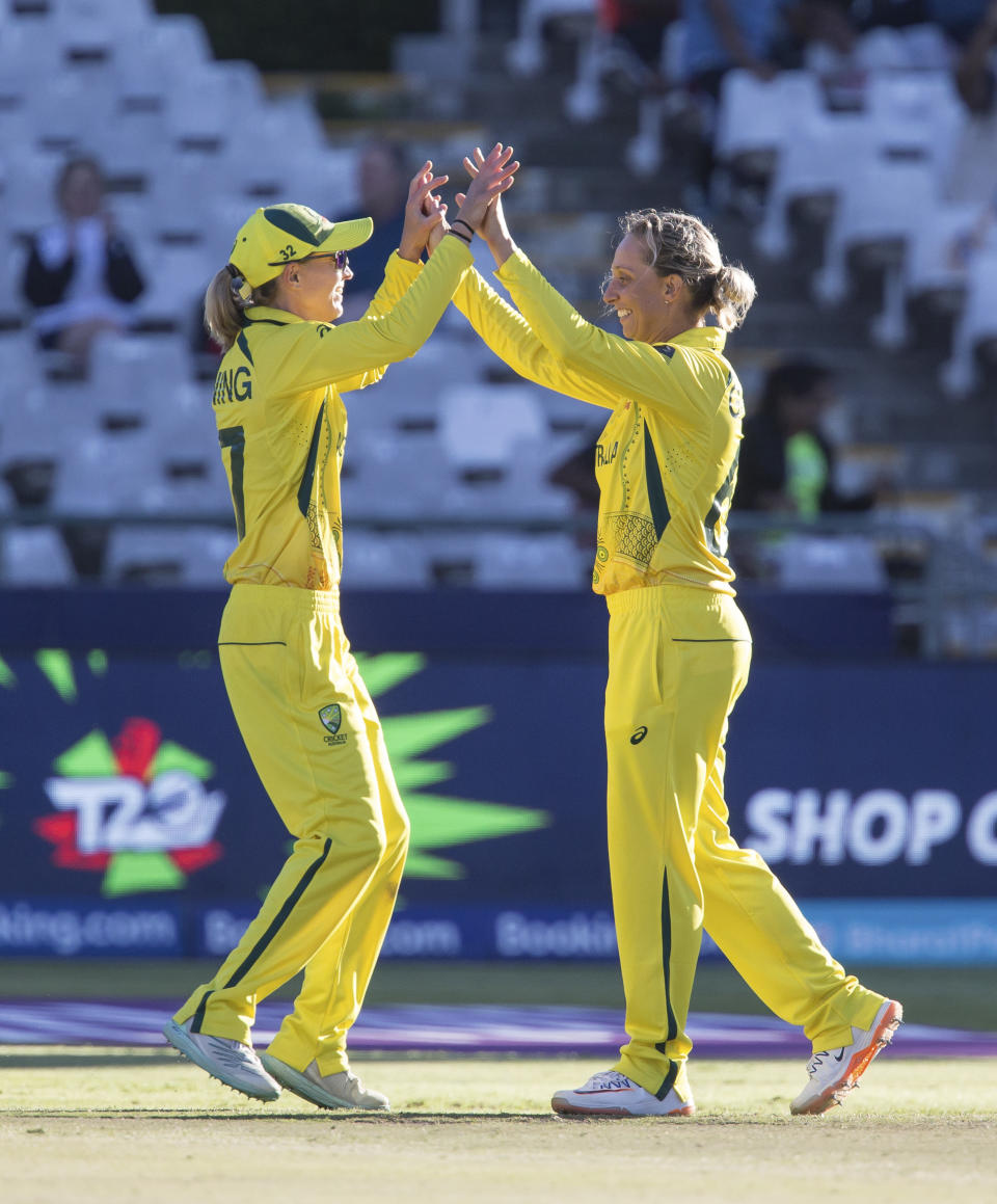 Australia celebrate beating India by 5 runs to commence to the Women's T20 World Cup Final in Cape Town, South Africa, Thursday Feb. 23, 2023. (AP Photo/Halden Krog)