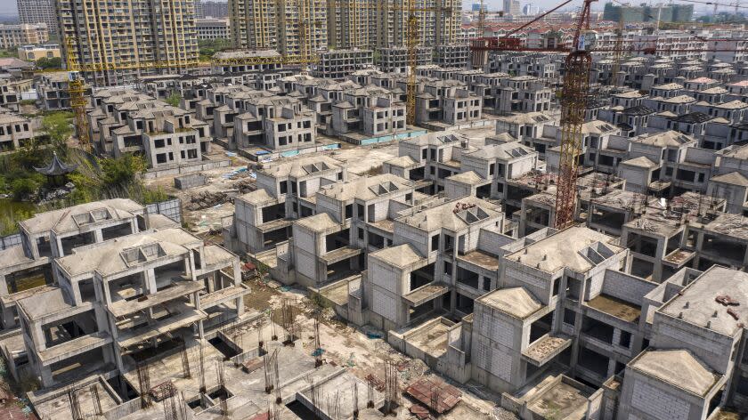 Residential buildings under construction at Tahoe Group Co.'s Cathay Courtyard development in Shanghai, China, on Wednesday, July 27, 2022. The year-long slump in the property market is likely to be a focus for the Politburo, the country's top decision-making body, with the recent spate of people not paying their mortgages threatening to drag sales down even further and damage banks and builders. Photographer: Qilai Shen/Bloomberg via Getty Images