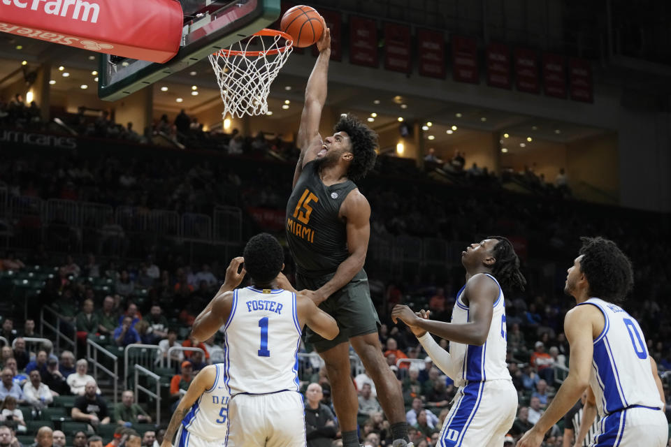 Miami forward Norchad Omier (15) attempts a dunk during the second half of an NCAA college basketball game against Duke, Wednesday, Feb. 21, 2024, in Coral Gables, Fla. (AP Photo/Wilfredo Lee)