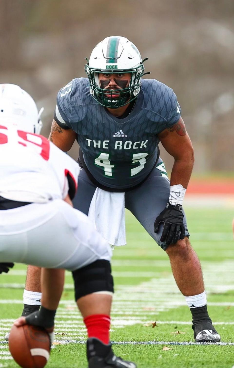 Slippery Rock linebacker Cody Ross lines up before the start of a play for The Rock.